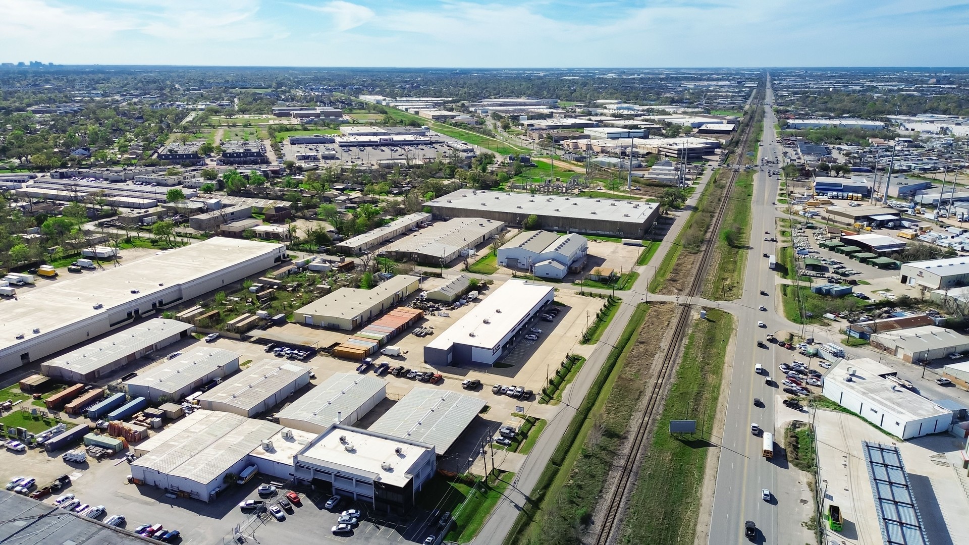 Industrial Park in Northwest Houston submarket along Hempstead, railroad near US-290, Highway 6, Interstate 10, complex logistics, warehousing, distribution in regional hubs, Beltway 8, aerial
